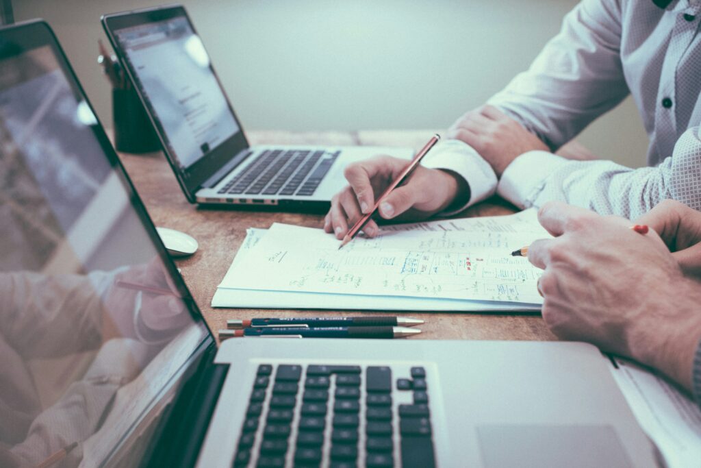 Photo showing two people discussing investment goals or other topics. Used as a way to show that you aren't alone when it comes to investing.